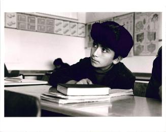 Georgian Jewish boy wearing Russian hat in class, Israel