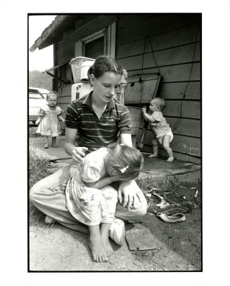 [Girl Crying with her Mother (Poor White People), Kentucky, USA]