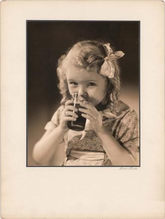 Advertisement: Child Drinking Welch’s Grape Juice