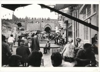 [Jews passing by an Arab café in the Old City, Jerusalem, Israel]